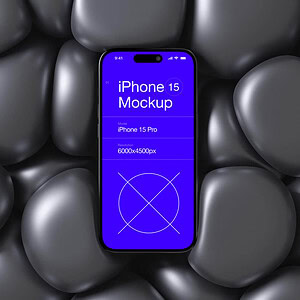 IPhone 15 mockup on black stones, showcasing modern smartphone design.